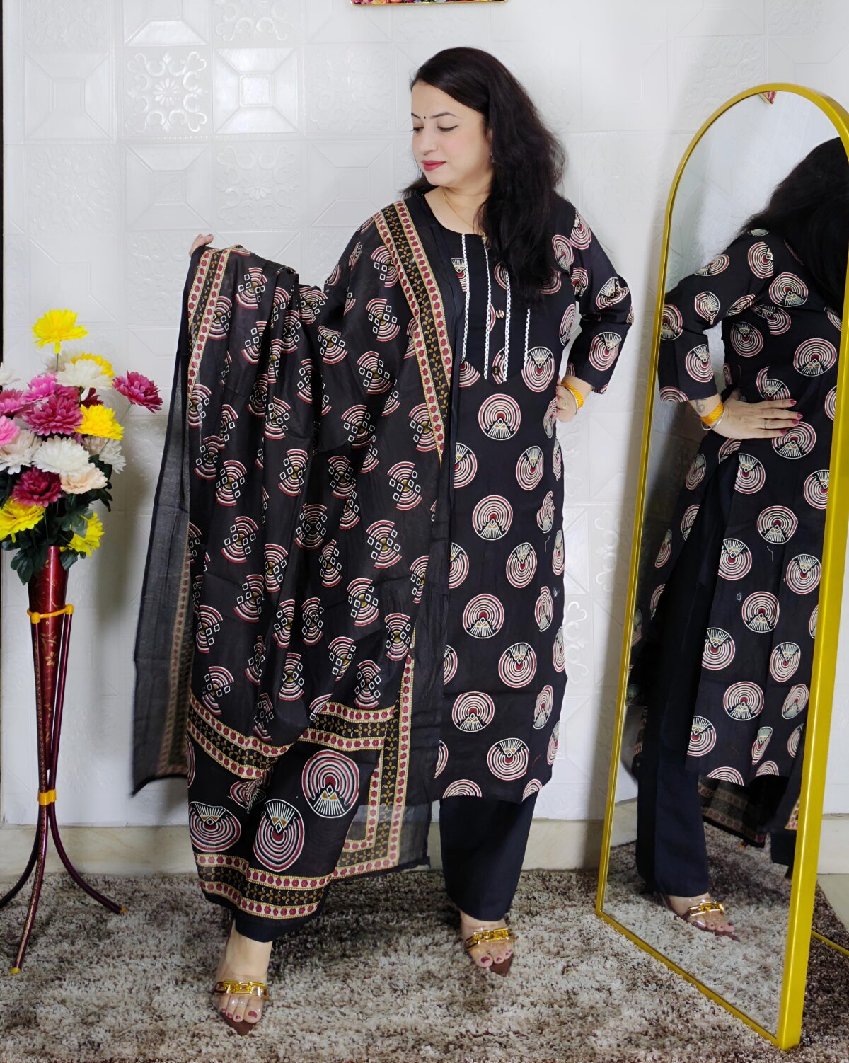 Woman wearing black printed pure cotton 3 piece suit set with matching dupatta and straight pants