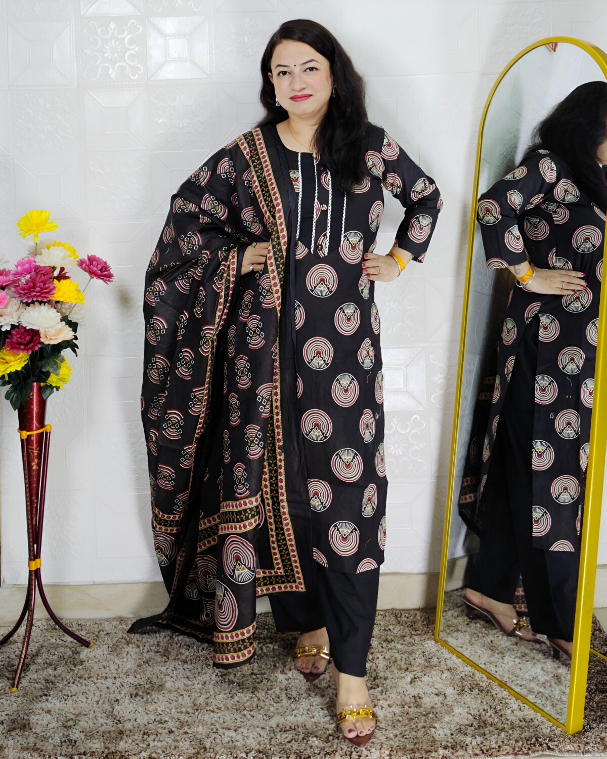 Woman wearing black printed pure cotton 3 piece suit set with matching dupatta and straight pants