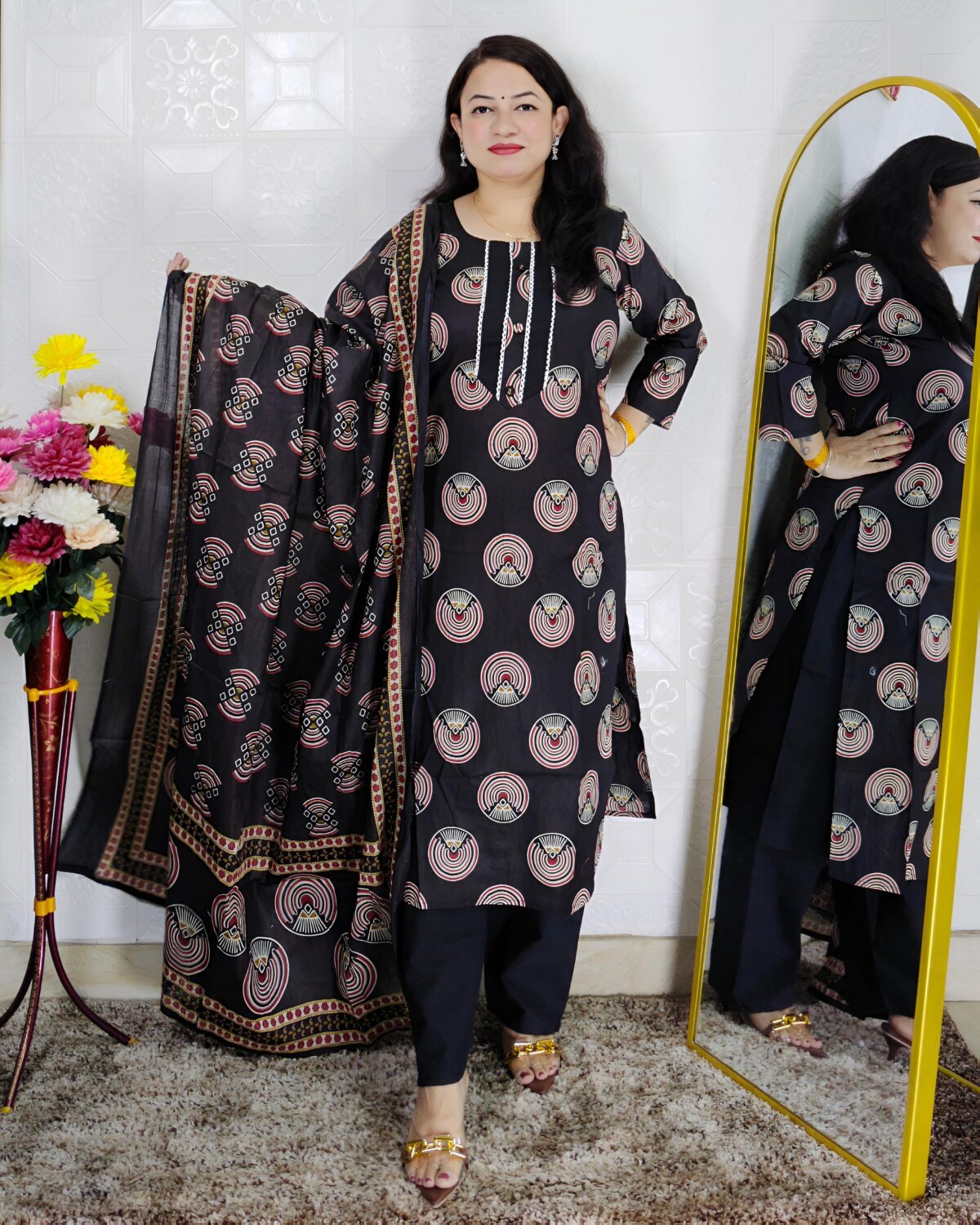 Woman wearing black printed pure cotton 3 piece suit set with matching dupatta and straight pants