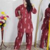 Woman wearing rust printed pure cotton co-ord set with collared top and matching straight-fit pants