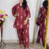 Woman wearing rust printed pure cotton co-ord set with collared top and matching straight-fit pants