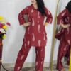 Woman wearing rust printed pure cotton co-ord set with collared top and matching straight-fit pants