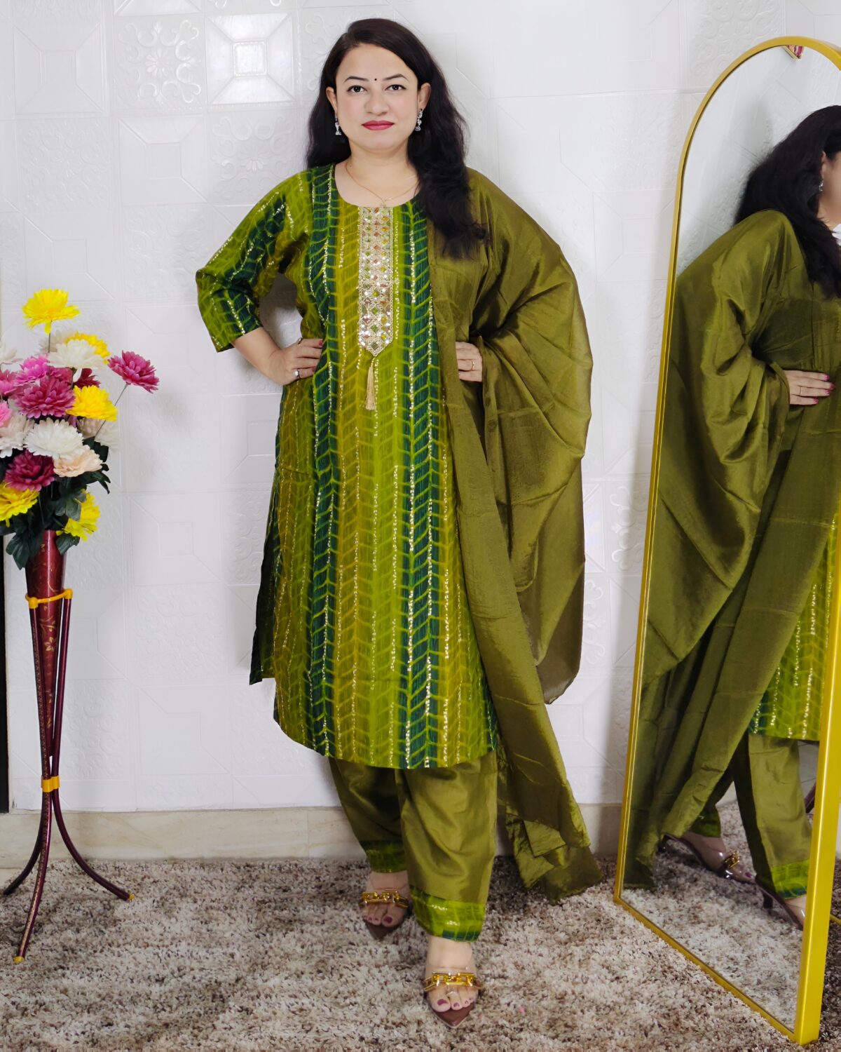 Woman wearing olive green tie-dye cotton suit set with matching pants and dupatta