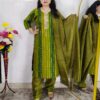 Woman wearing olive green tie-dye cotton suit set with matching pants and dupatta