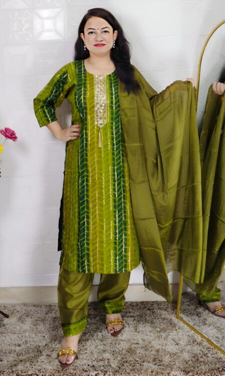 Woman wearing olive green tie-dye cotton suit set with matching pants and dupatta