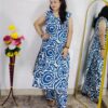 Woman wearing Blue Abstract Printed Cotton Co-Ord Set with Sleeveless Kurta, Wide-Leg Pants and Side Pocket