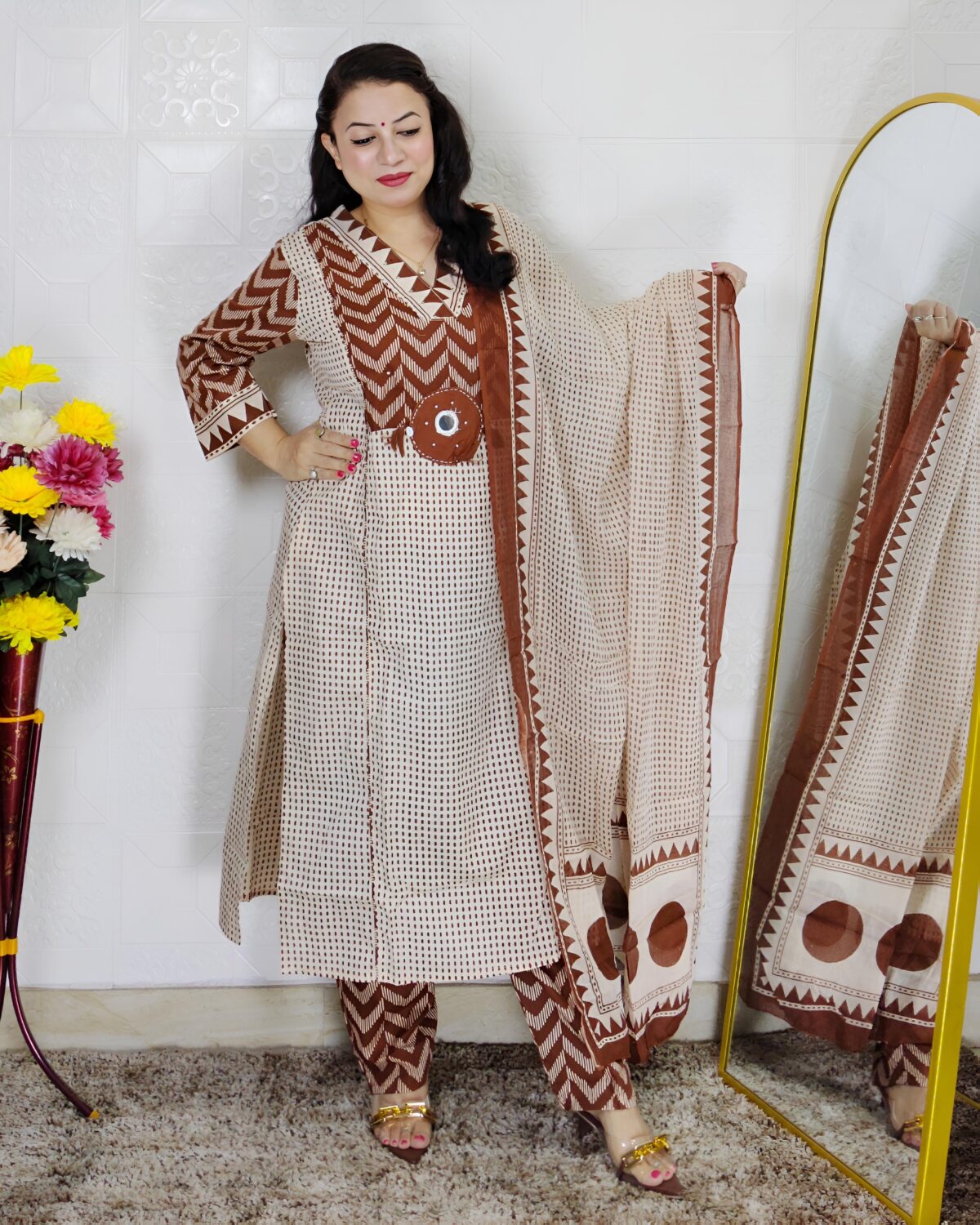 Woman wearing Cream Brown Evil Eye Printed Pure Cotton 3 Piece Suit Set with Matching Dupatta