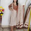 Woman wearing Cream Brown Evil Eye Printed Pure Cotton 3 Piece Suit Set with Matching Dupatta