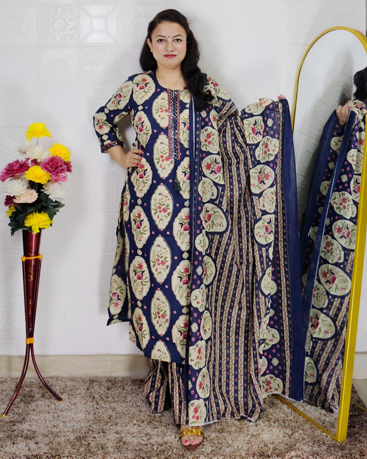 Woman wearing Navy Blue Ajrakh Print Premium Cotton Straight Kurta Suit Set with Printed Palazzo Pants and Matching Cotton Dupatta