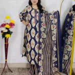 Woman wearing Navy Blue Ajrakh Print Premium Cotton Straight Kurta Suit Set with Printed Palazzo Pants and Matching Cotton Dupatta