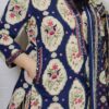 Woman wearing Navy Blue Ajrakh Print Premium Cotton Straight Kurta Suit Set with Printed Palazzo Pants and Matching Cotton Dupatta