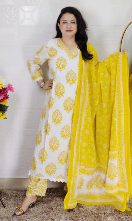 Woman wearing Off White and Yellow Printed Premium Cotton Straight Kurta Suit Set with Inner Lining, Matching Pants and Dupatta