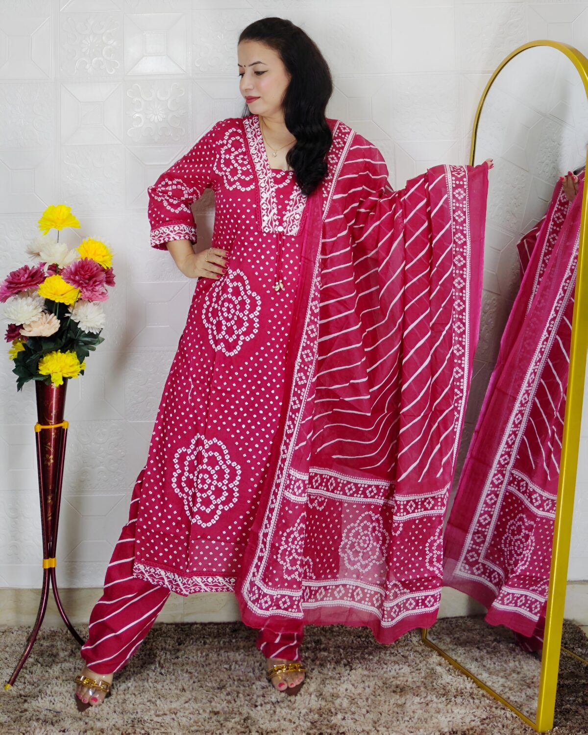 Woman wearing Pink Bandhani Print Premium Cotton Straight Kurta Suit Set with Printed Pants and Matching Cotton Dupatta