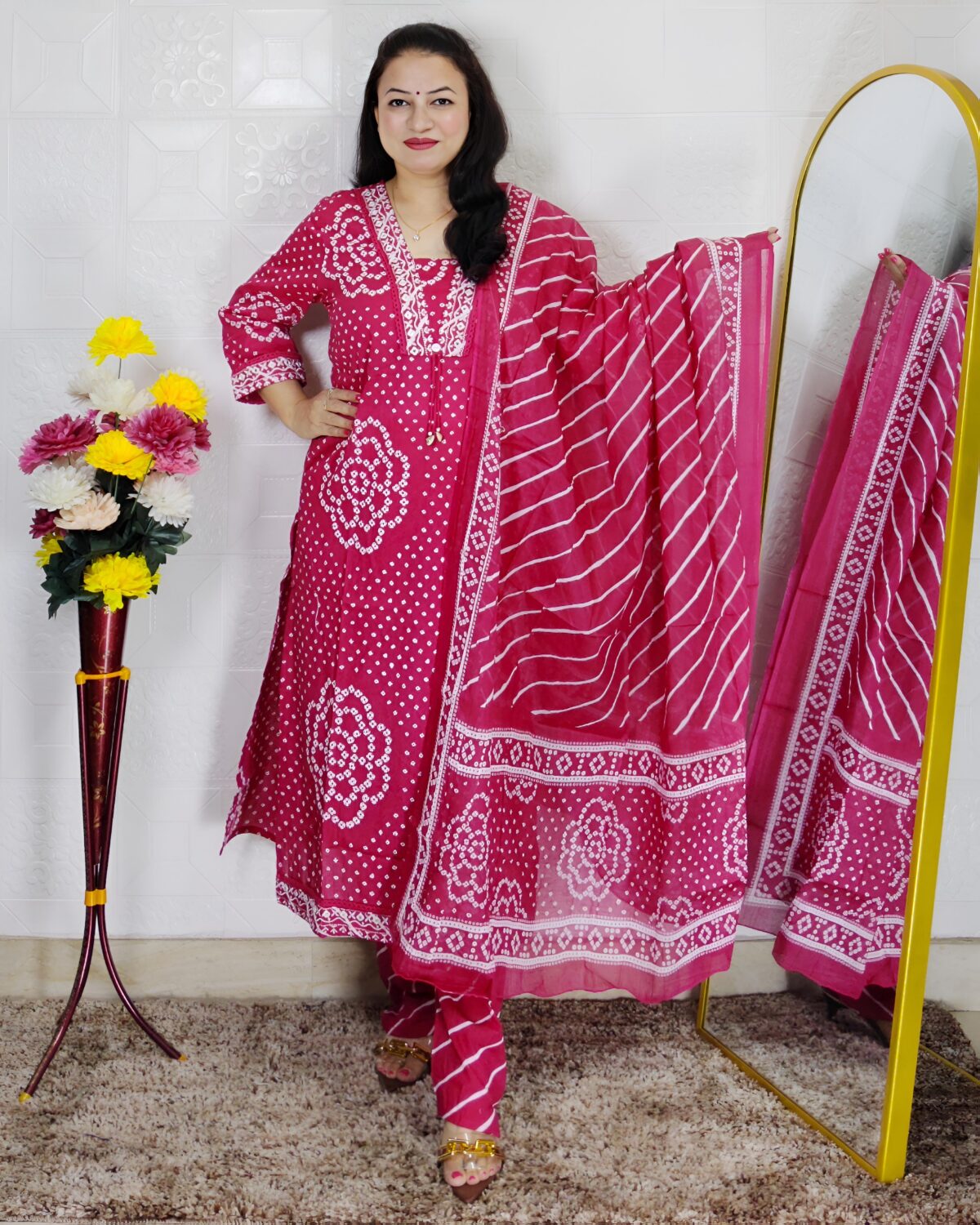 Woman wearing Pink Bandhani Print Premium Cotton Straight Kurta Suit Set with Printed Pants and Matching Cotton Dupatta