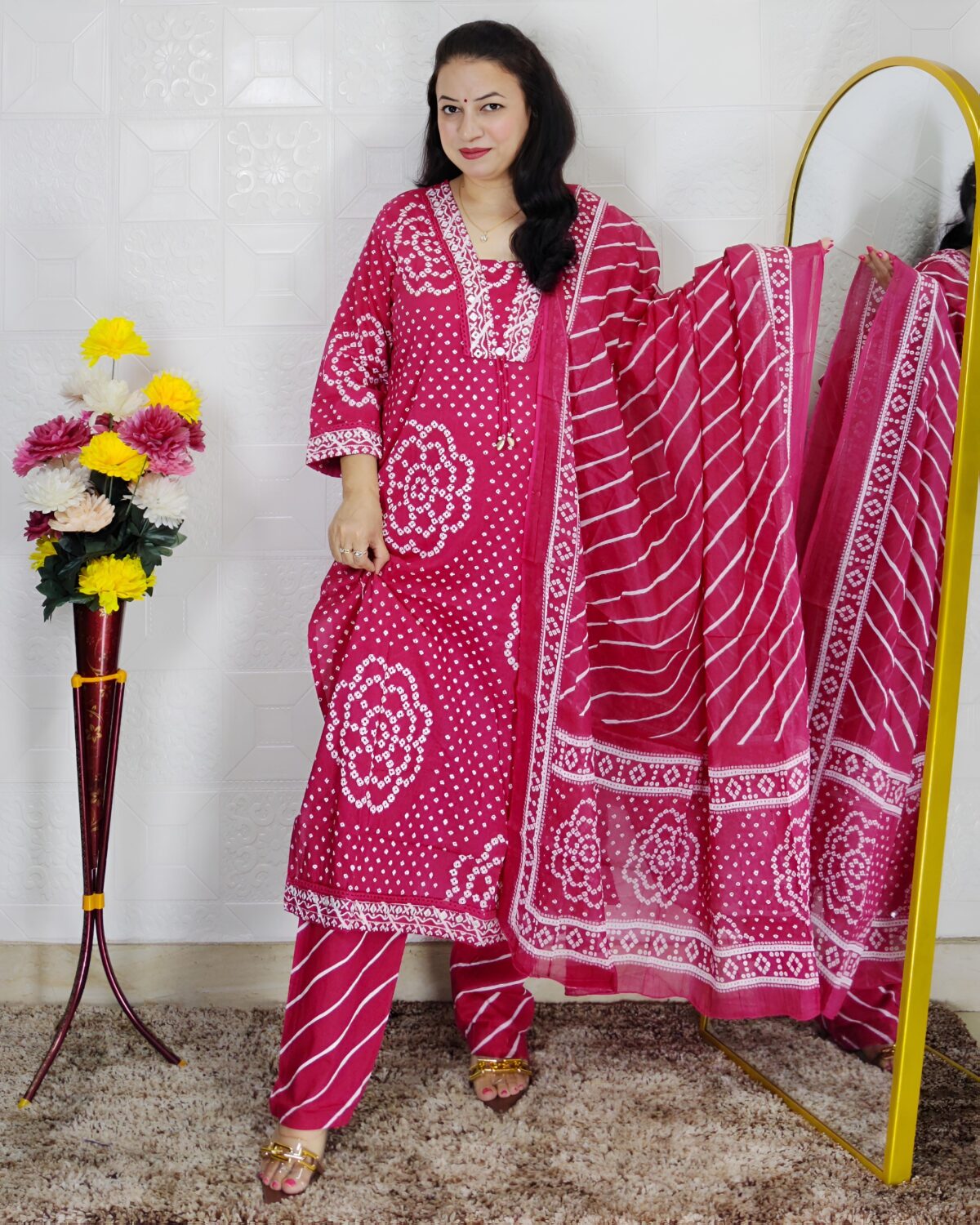 Woman wearing Pink Bandhani Print Premium Cotton Straight Kurta Suit Set with Printed Pants and Matching Cotton Dupatta