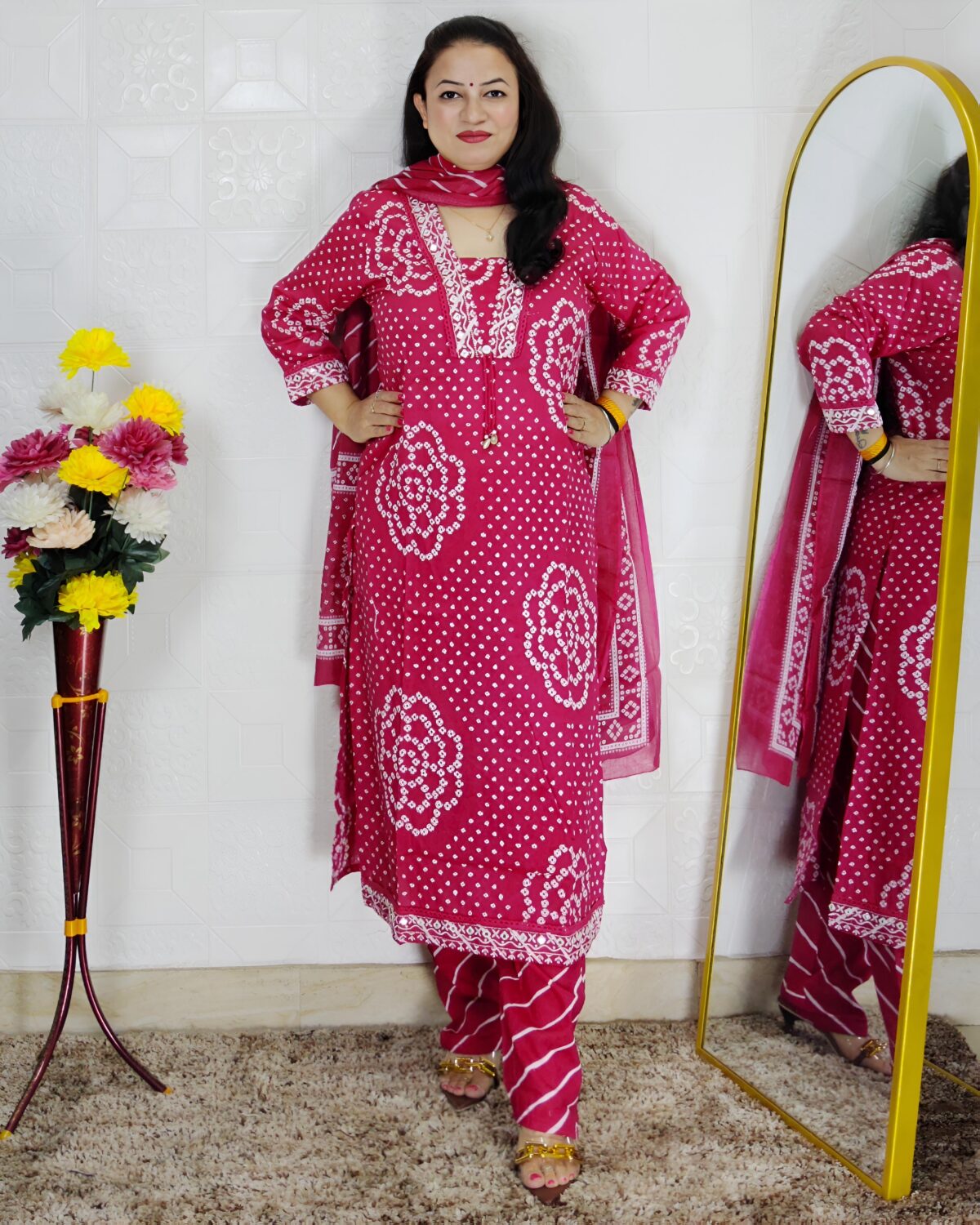 Woman wearing Pink Bandhani Print Premium Cotton Straight Kurta Suit Set with Printed Pants and Matching Cotton Dupatta