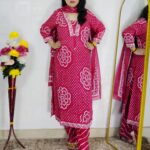 Woman wearing Pink Bandhani Print Premium Cotton Straight Kurta Suit Set with Printed Pants and Matching Cotton Dupatta