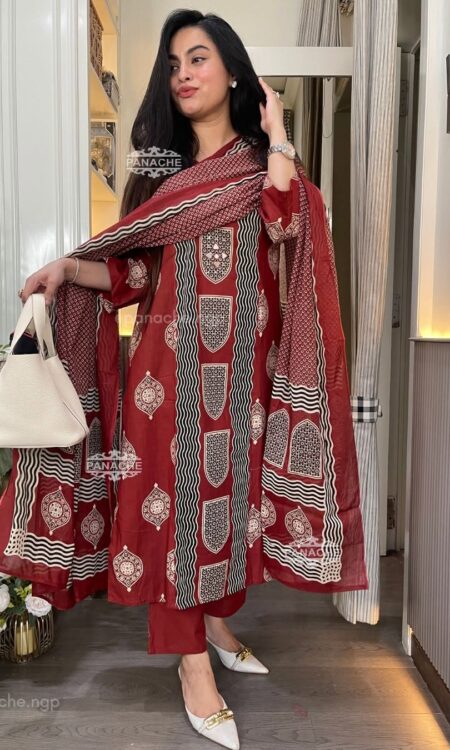 Woman wearing Rust Premium Cotton Printed Straight Kurta Suit Set with Matching Pants and Printed Dupatta