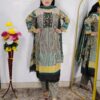 Woman wearing Teal Green Printed Cotton Straight Kurta Suit Set with Printed Palazzo Pants and Floral Printed Dupatta