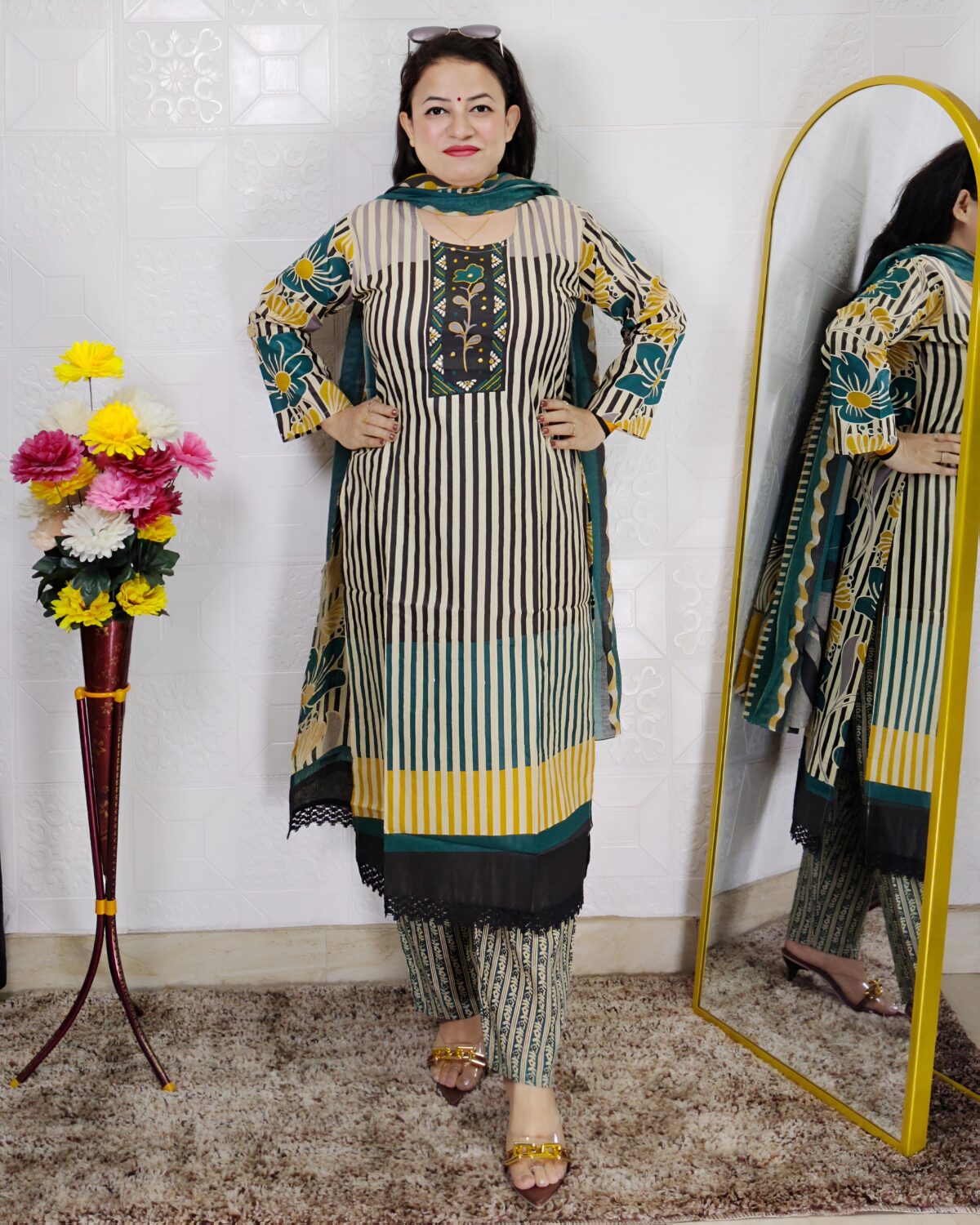Woman wearing Teal Green Printed Cotton Straight Kurta Suit Set with Printed Palazzo Pants and Floral Printed Dupatta