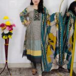 Woman wearing Teal Green Printed Cotton Straight Kurta Suit Set with Printed Palazzo Pants and Floral Printed Dupatta